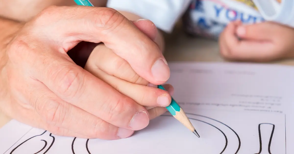 Correct tripod pencil grip for KS1 children — three-finger hold demonstrating relaxed, correct position
